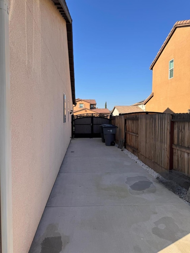 view of side of property featuring a patio