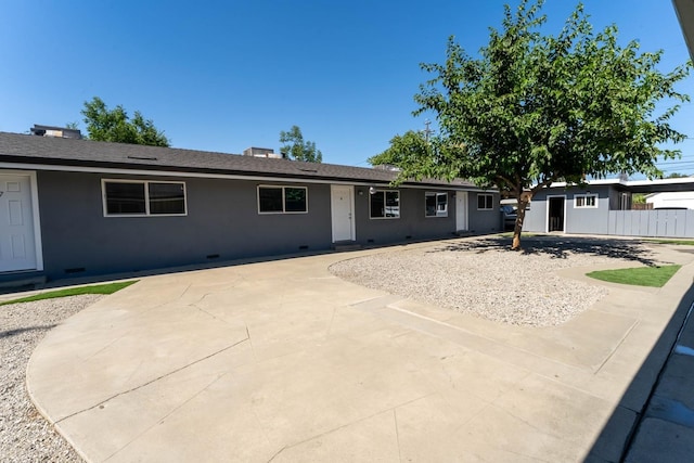 ranch-style home with a patio area