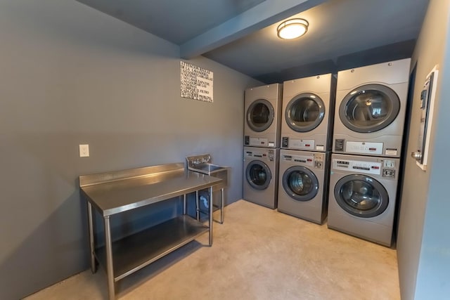 laundry room featuring stacked washer / dryer