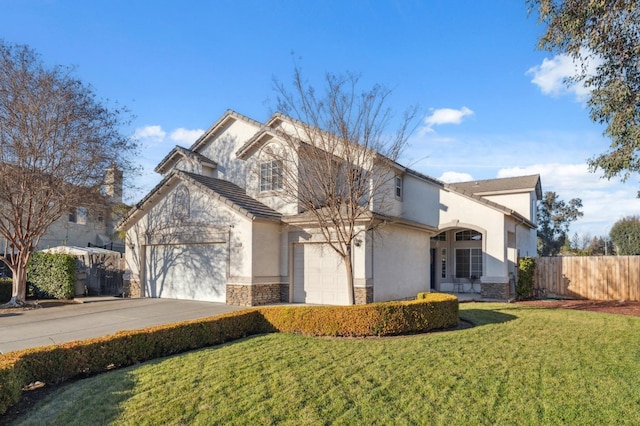 front of property featuring a garage and a front lawn