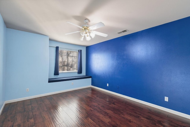 spare room with ceiling fan and wood-type flooring