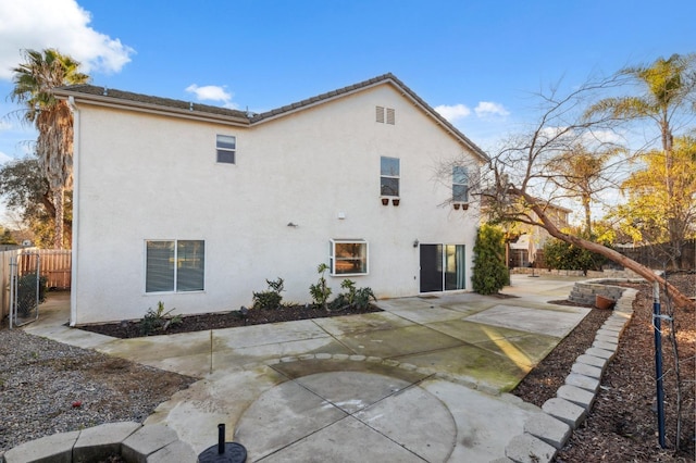 back of property featuring a patio