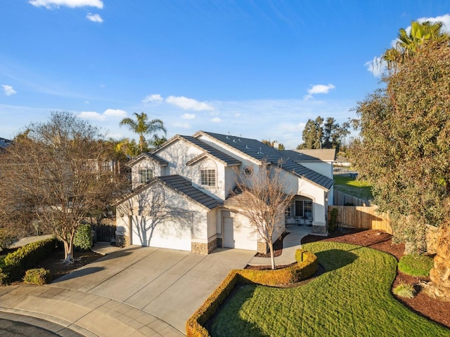 view of front facade with a garage and a front lawn