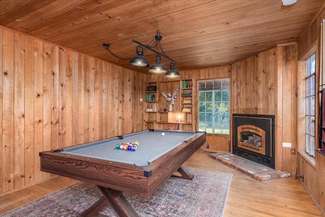 game room with pool table, light wood-type flooring, wooden ceiling, and wooden walls