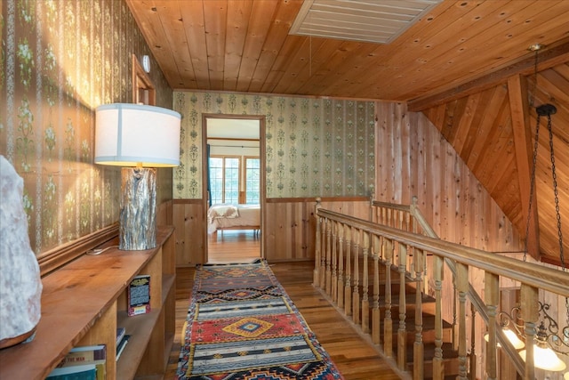 hallway featuring hardwood / wood-style floors and wooden ceiling