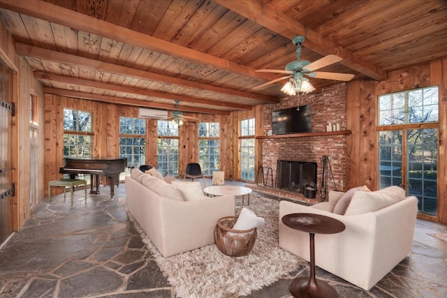 living room with a wall mounted AC, a brick fireplace, wood walls, and beam ceiling