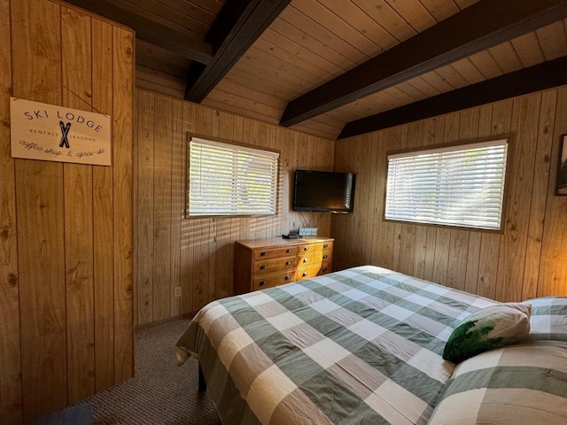 carpeted bedroom with wood walls, wood ceiling, and beam ceiling