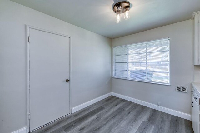 unfurnished room featuring hardwood / wood-style floors