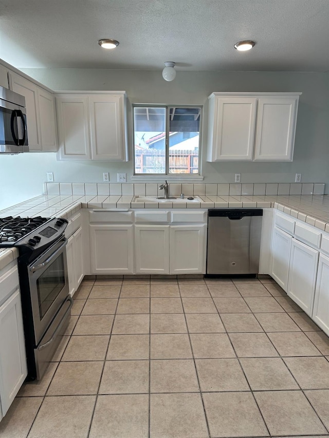 kitchen featuring white cabinets and stainless steel appliances