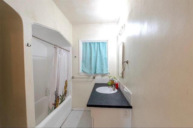 bathroom with vanity, tile patterned floors, and shower / bath combo with shower curtain