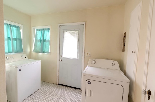 clothes washing area with washer and dryer