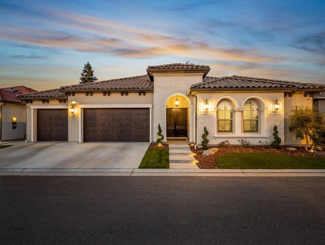 mediterranean / spanish-style house featuring a garage