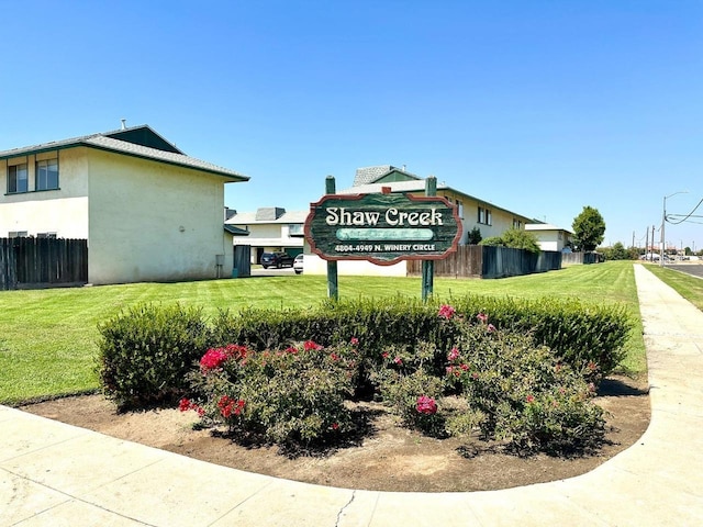 community sign with a lawn