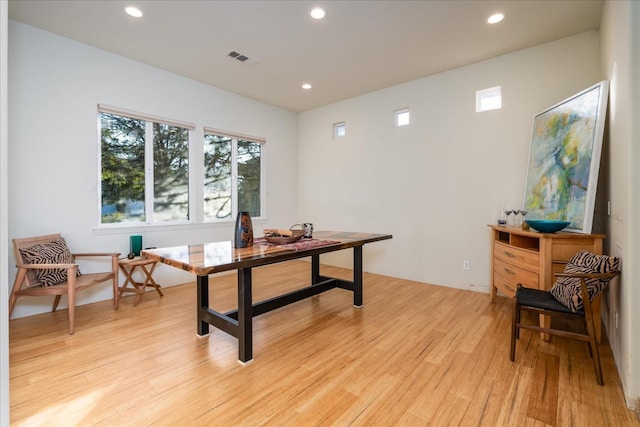 office space with light hardwood / wood-style floors