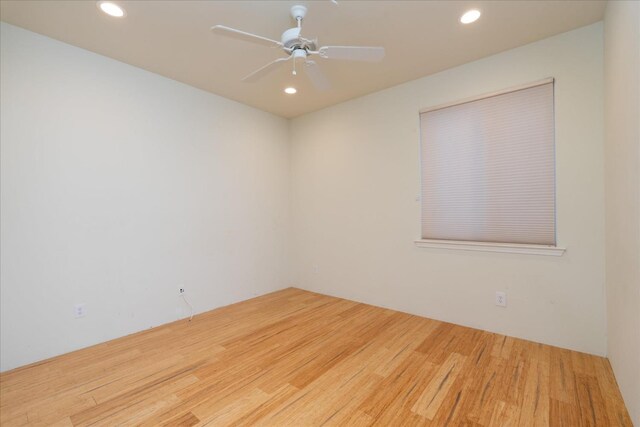 unfurnished room with ceiling fan and wood-type flooring