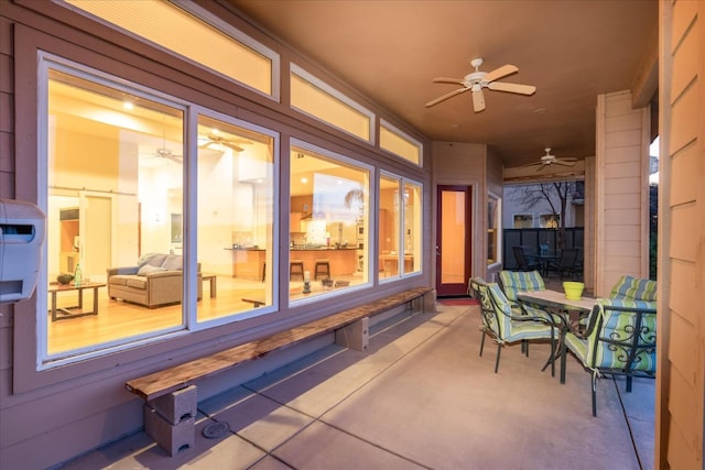 view of patio / terrace featuring ceiling fan