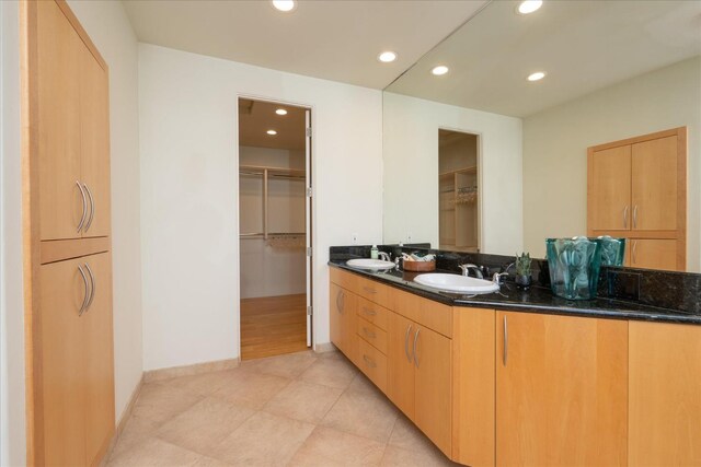 bathroom with tile patterned floors and vanity