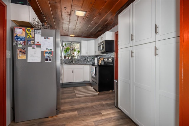 kitchen with stainless steel appliances, white cabinets, backsplash, dark hardwood / wood-style flooring, and wood ceiling