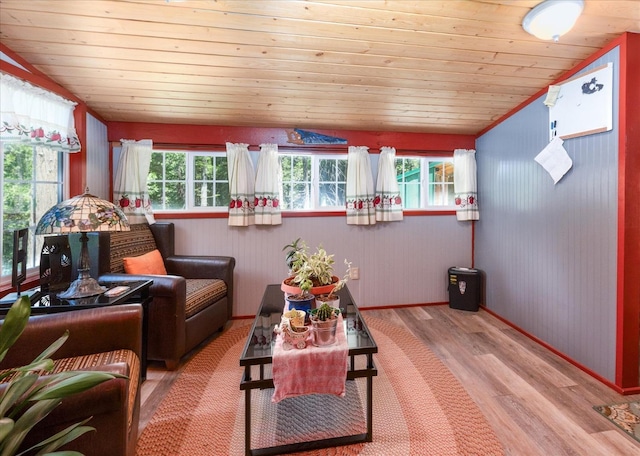 sunroom / solarium featuring wooden ceiling and vaulted ceiling