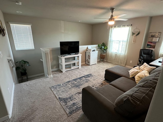 living room with ceiling fan and carpet flooring