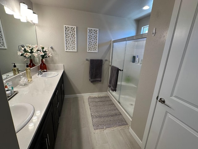 bathroom with an enclosed shower and vanity