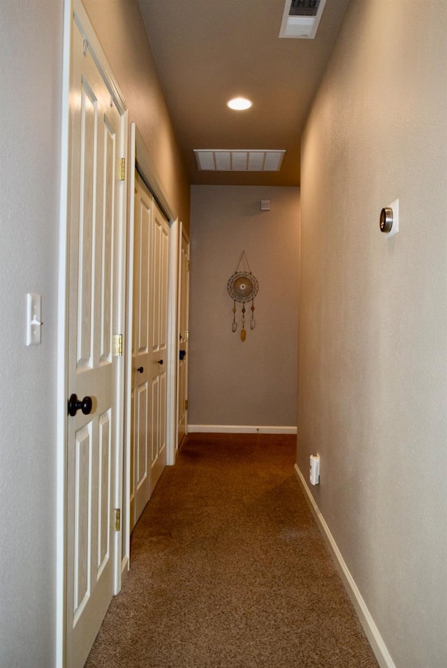 hallway featuring carpet