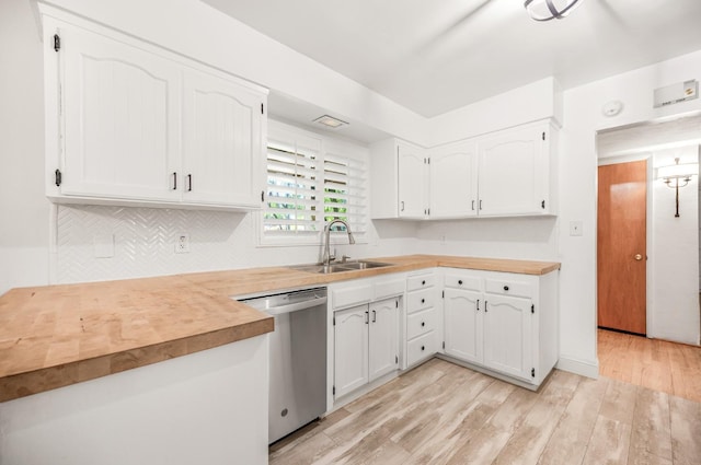 kitchen featuring dishwasher, light wood-type flooring, decorative backsplash, white cabinets, and sink