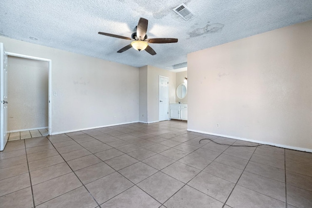 tiled empty room with ceiling fan