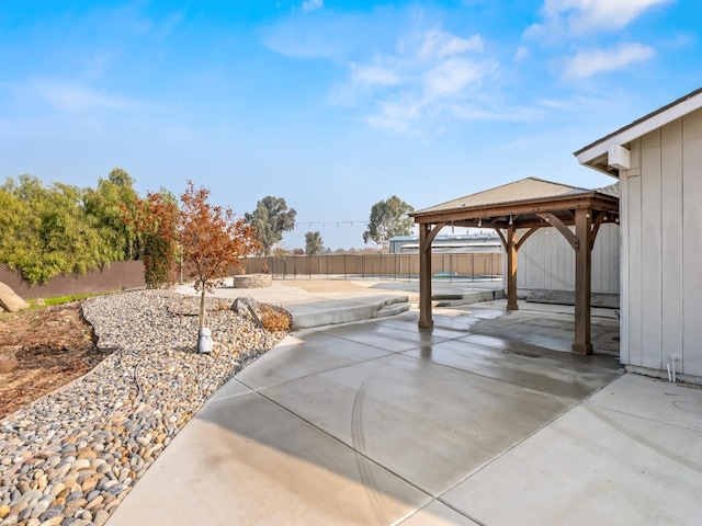 view of patio / terrace with a fenced backyard and a gazebo