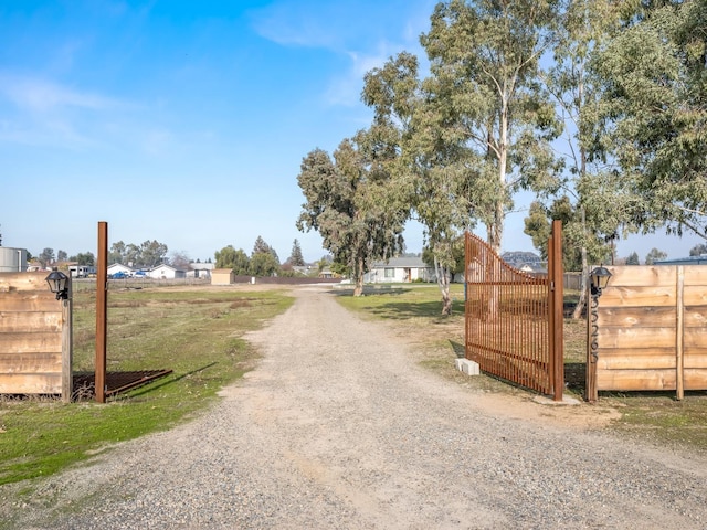 view of street with gravel driveway