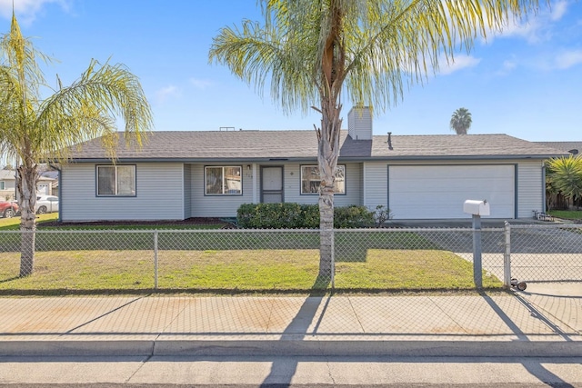 ranch-style home featuring a garage and a front lawn