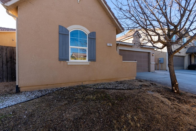 view of property exterior featuring a garage