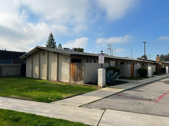 exterior space with a front yard