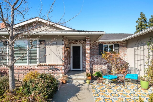 doorway to property with a patio area