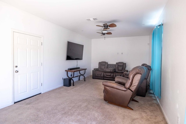 carpeted living room featuring ceiling fan