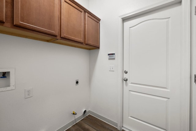 washroom featuring washer hookup, cabinets, hookup for an electric dryer, hookup for a gas dryer, and dark wood-type flooring