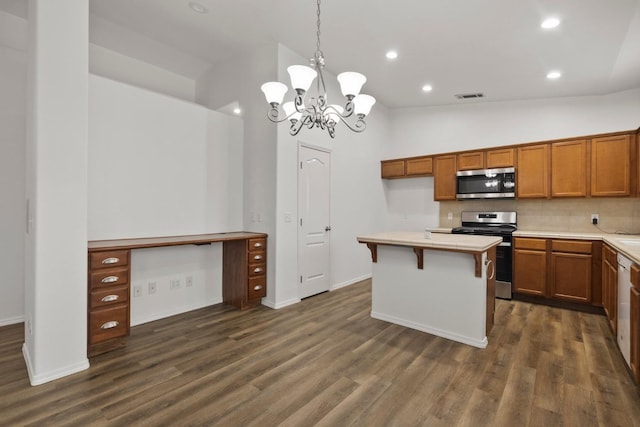 kitchen featuring pendant lighting, stainless steel appliances, lofted ceiling, an inviting chandelier, and backsplash