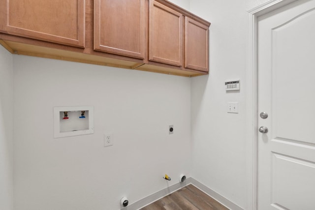 laundry area with cabinets, wood-type flooring, hookup for a washing machine, hookup for a gas dryer, and hookup for an electric dryer