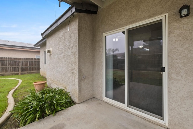 entrance to property with a lawn