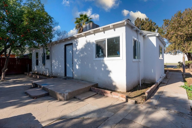 back of property with a patio