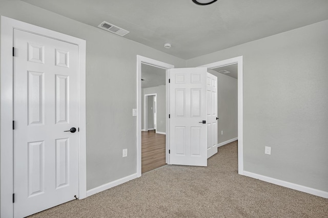 unfurnished bedroom featuring carpet