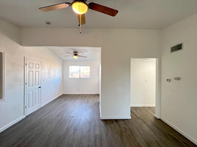 unfurnished room featuring dark wood-type flooring