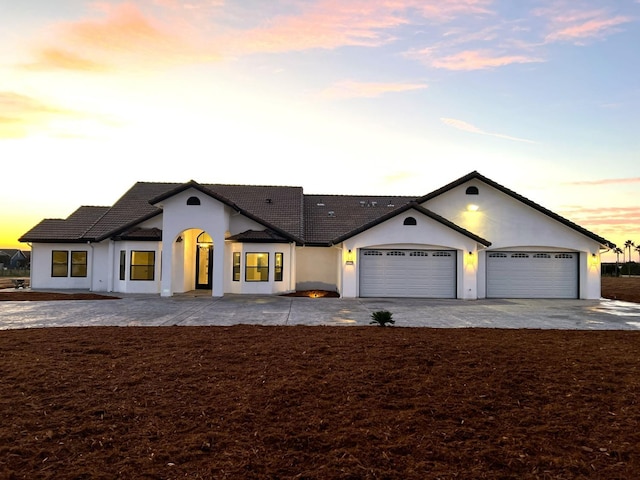 view of front of property with a garage