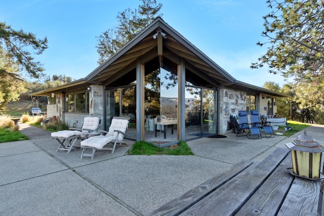 back of property featuring a patio area