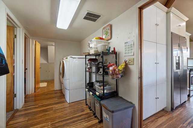 laundry area featuring washer / clothes dryer and dark hardwood / wood-style floors