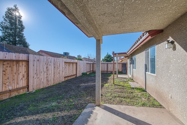 view of yard with a patio and a fenced backyard