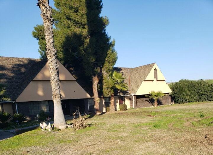 view of side of home featuring a yard