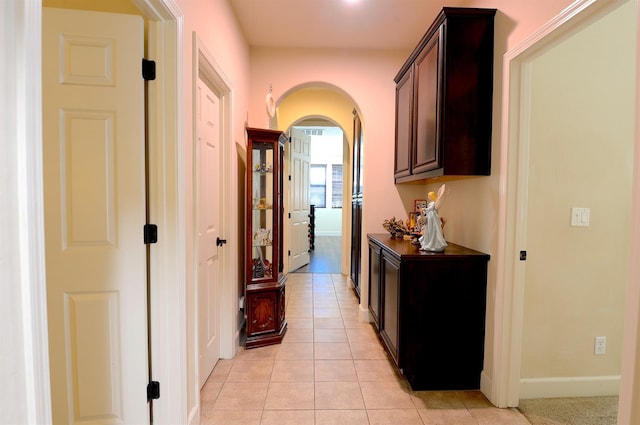 corridor with light tile patterned floors