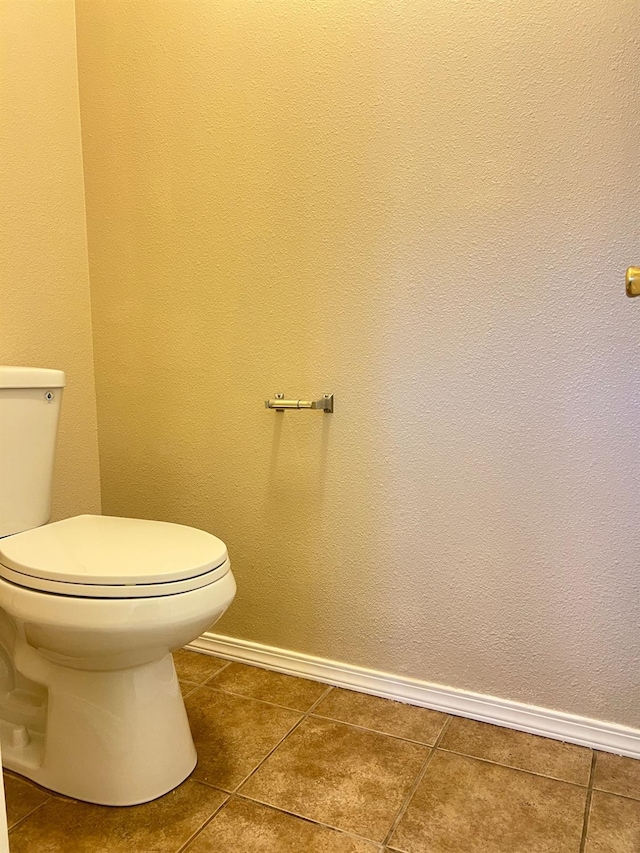 bathroom featuring tile patterned floors and toilet