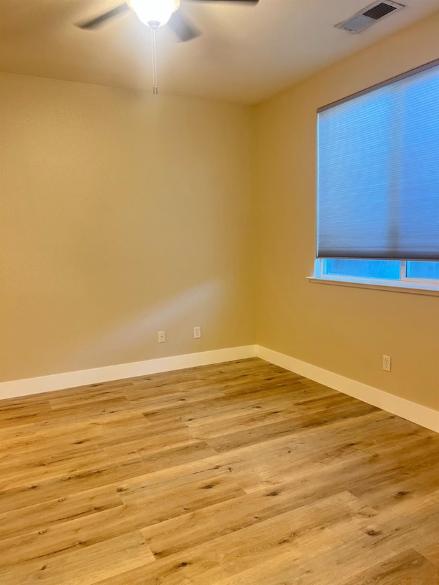 unfurnished room featuring ceiling fan and light hardwood / wood-style flooring